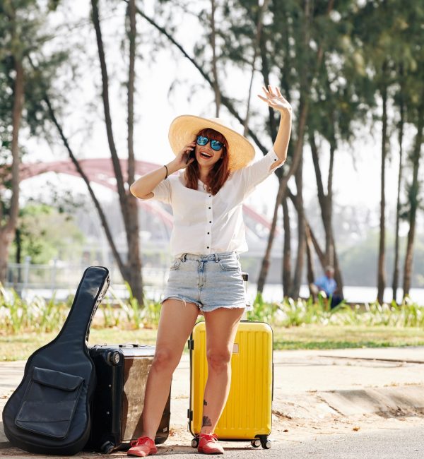 female-traveler-trying-to-chatch-car.jpg
